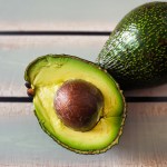 A Close-up of Hass avocados on a table.